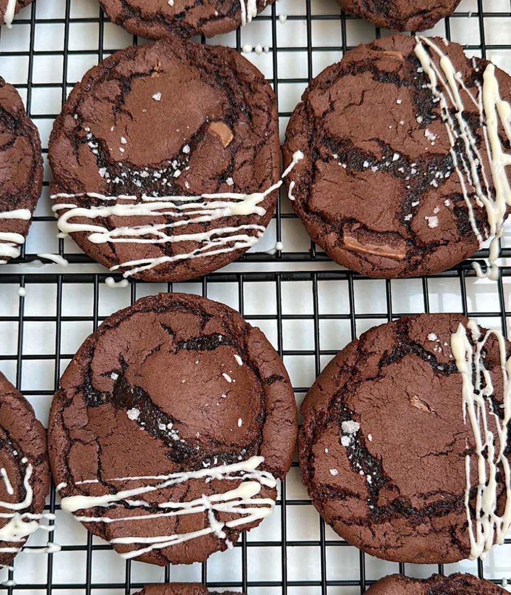Buy Brookie - Chocolate Brownie Cookies with White Chocolate Poppy Seeds Glaze & Sea Salt from Poppylicious Bakery available online at VEND. Explore more desserts now
