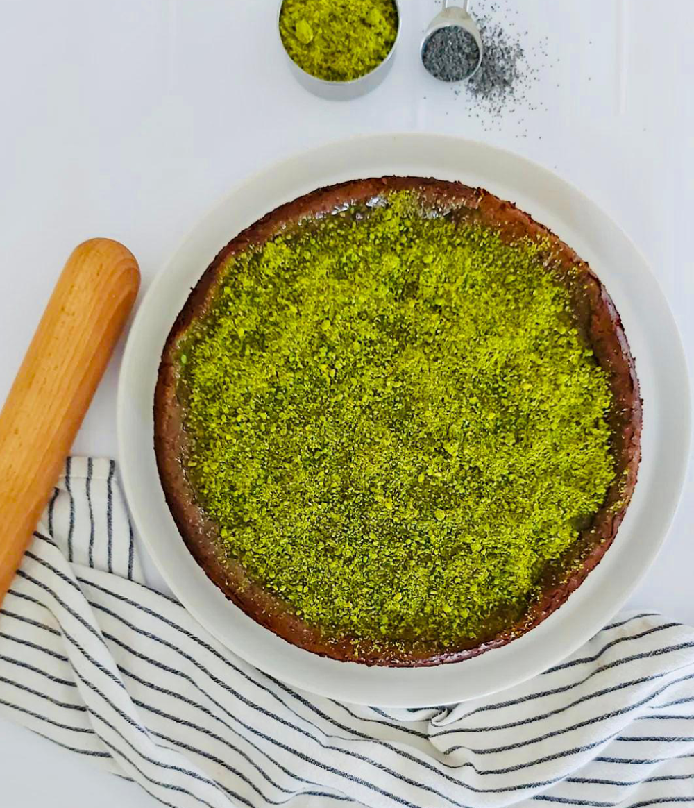 Buy Pistachio Cheese Cake | Rich Filling with Poppy Seeds & Caramel Sauce from Poppylicious Bakery available online at VEND. Explore more desserts now