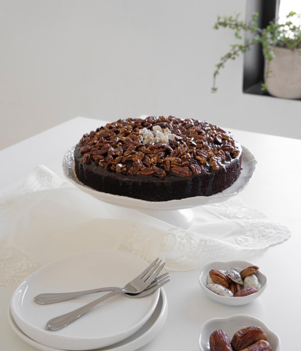 Buy Sticky Pecan Date Cake | Moist Date Poppy Seeds Cake with Roasted Pecans and Toffee Sauce from Poppylicious Bakery available online at VEND. Explore more desserts now